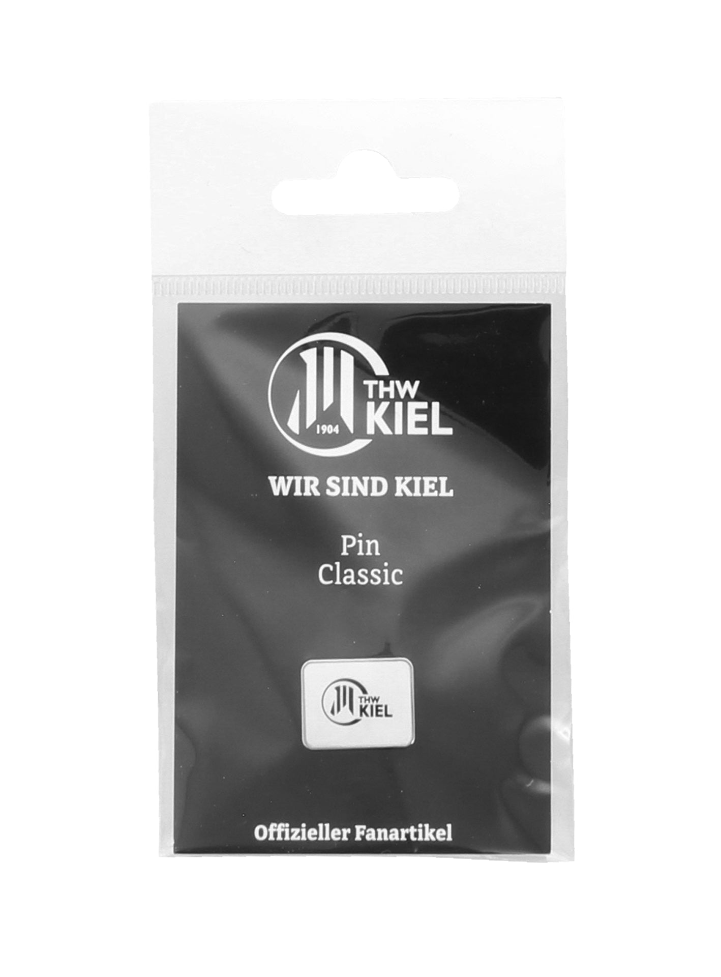 Der Pin Classic weiß zeigt das THW Kiel-Logo mit "WIR SIND KIEL" und "Offizieller Fanartikel", verpackt auf einer schwarz-weißen Karte in einer transparenten Plastiktüte.
