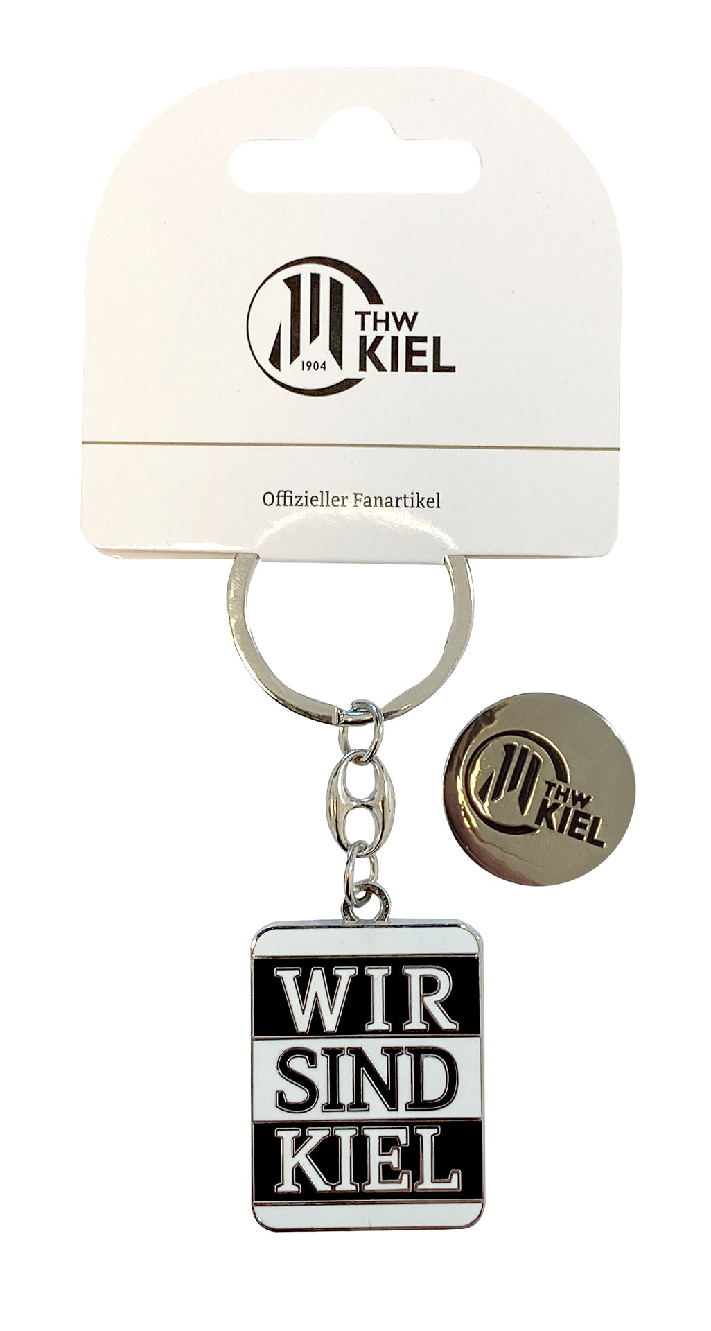 Der Schlüsselanhänger Chip ist ein THW Kiel Fanartikel in Schwarz-Weiß mit "WIR SIND KIEL", Einkaufschip und rundem Metall-Pin mit Logo, präsentiert in weißer Verpackung.