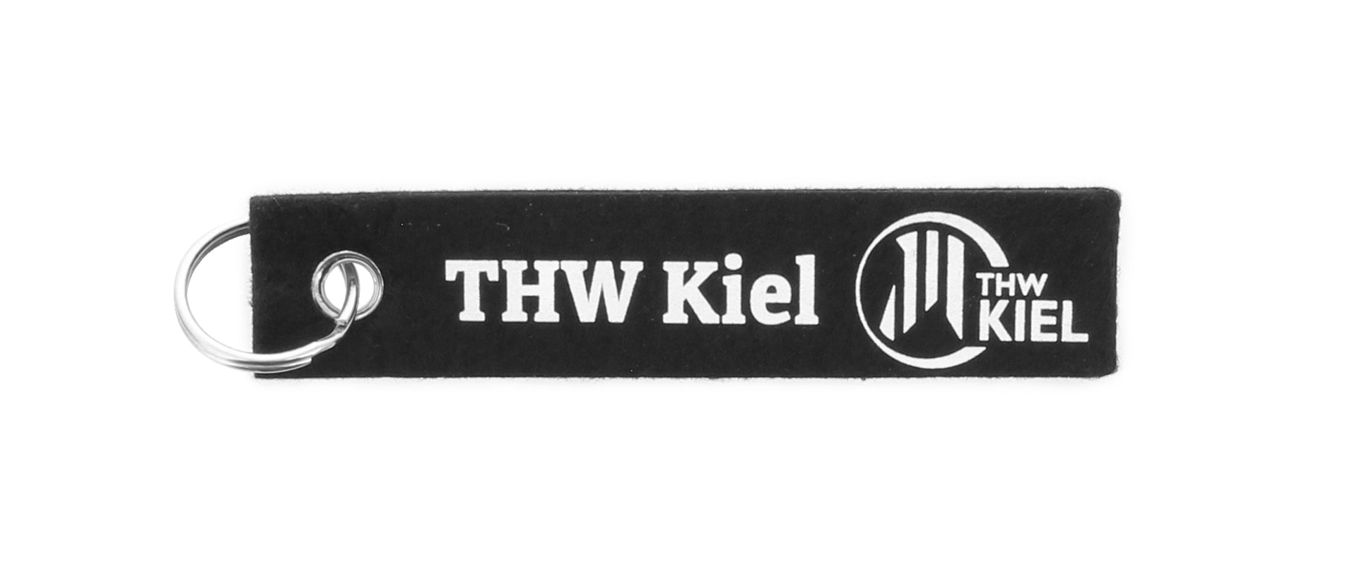 Der Schlüsselfilz ist ein schwarzer, rechteckiger Filz-Schlüsselanhänger mit Metallring, auf dem der weiße Schriftzug "THW Kiel" und ein kreisrundes THW KIEL-Logo zu sehen sind.