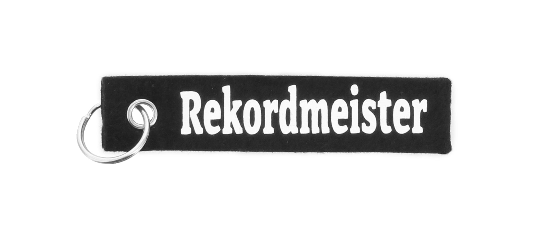 Der Schlüsselfilz ist ein schwarzer Filz-Schlüsselanhänger mit einem stabilen Ring und dem Schriftzug "Rekordmeister" in fetten weißen Buchstaben - das perfekte Accessoire für jeden THW Kiel-Fan.